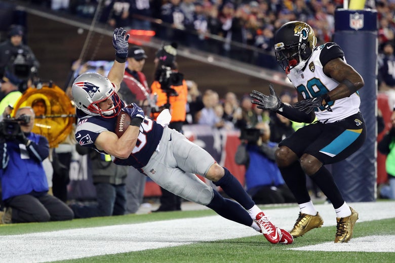 FOXBOROUGH, MA - JANUARY 21: Danny Amendola #80 of the New England Patriots catches a touchdown pass as he is defended by Tashaun Gipson #39 of the Jacksonville Jaguars in the fourth quarter during the AFC Championship Game at Gillette Stadium on January 21, 2018 in Foxborough, Massachusetts. (Photo by Elsa/Getty Images)